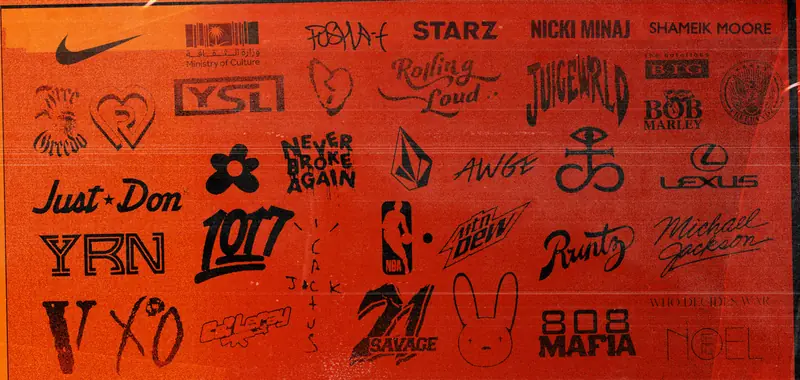 Logo wall from Grant’s portfolio, including Nike, the Saudi Ministry of Culture, Juice WRLD, Lexus, the NBA, MTN Dew, Runtz, 21 Savage, XO, VLONE, Who Decides War and more